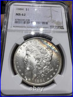 1884 NGC MS62 Morgan Silver Dollar with a Touch Of Duel Sided Rainbow Toning