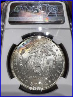 1884 NGC MS62 Morgan Silver Dollar with a Touch Of Duel Sided Rainbow Toning