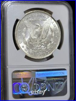 1885-O Morgan Silver Dollar NGC MS64 Rainbow Textile Tab Toned Coin Great Luster