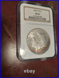 1885-O Vibrant Rainbow Toned Morgan Silver Dollar NGC MS63. Absolutely Gorgeous