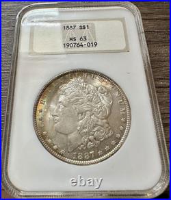 1887 American Silver Morgan Dollar Coin NGC MS63 RAINBOW CRESCENT OBV