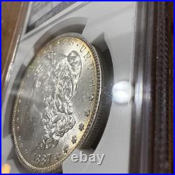 1887 Original Bag Fragment Toned Morgan Silver Dollar $1 NGC BU Brilliant UNC